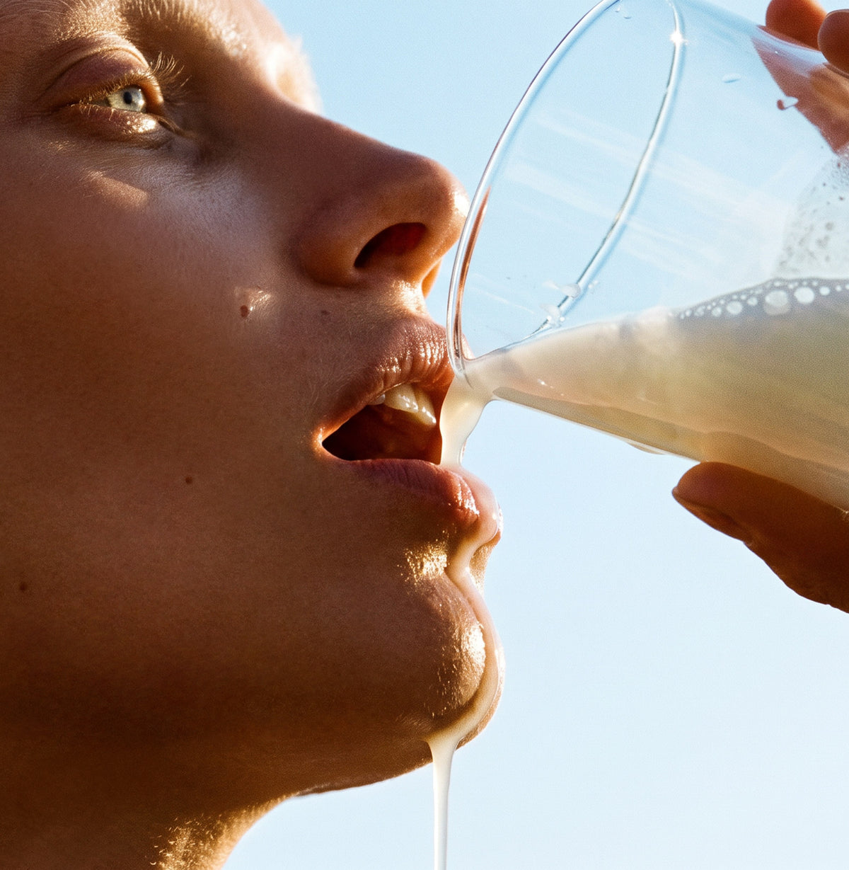 Aristaeos product ad, model drinking the colostrum.