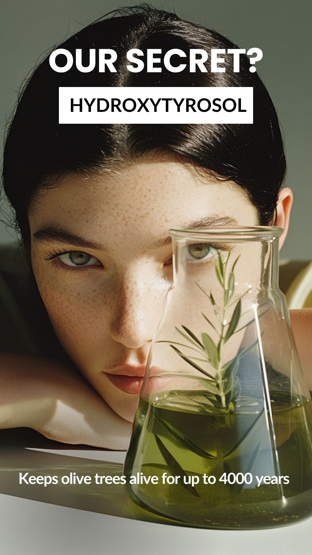 Model close-up beside a beaker with an olive sprig, overlay HYDROXYTYROSOL, keeps olive trees alive up to 4000 years