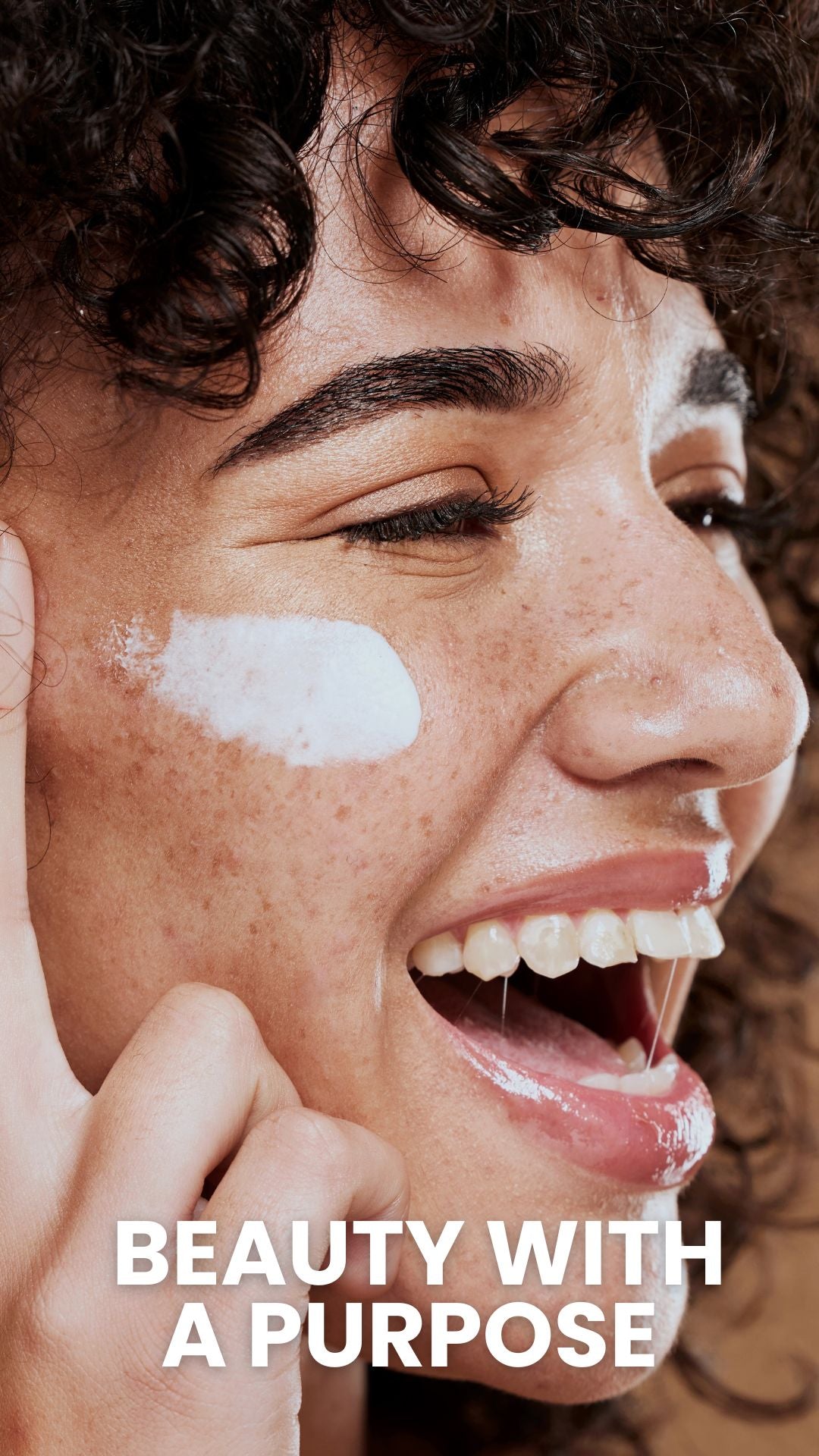 Smiling young woman applying white face cream to her cheek, overlaid headline 'BEAUTY WITH A PURPOSE'
