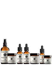 Cargar imagen en el visor de la galería, Front view of Healing Olive starter kit with amber pump, three dropper bottles and two jars on white