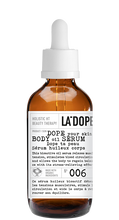 Load image into Gallery viewer, Brown dropper bottle labeled LA'DOPE — DOPE your skin BODY oil SERUM; MADE WITH ORGANIC INGREDIENTS Nº 006
