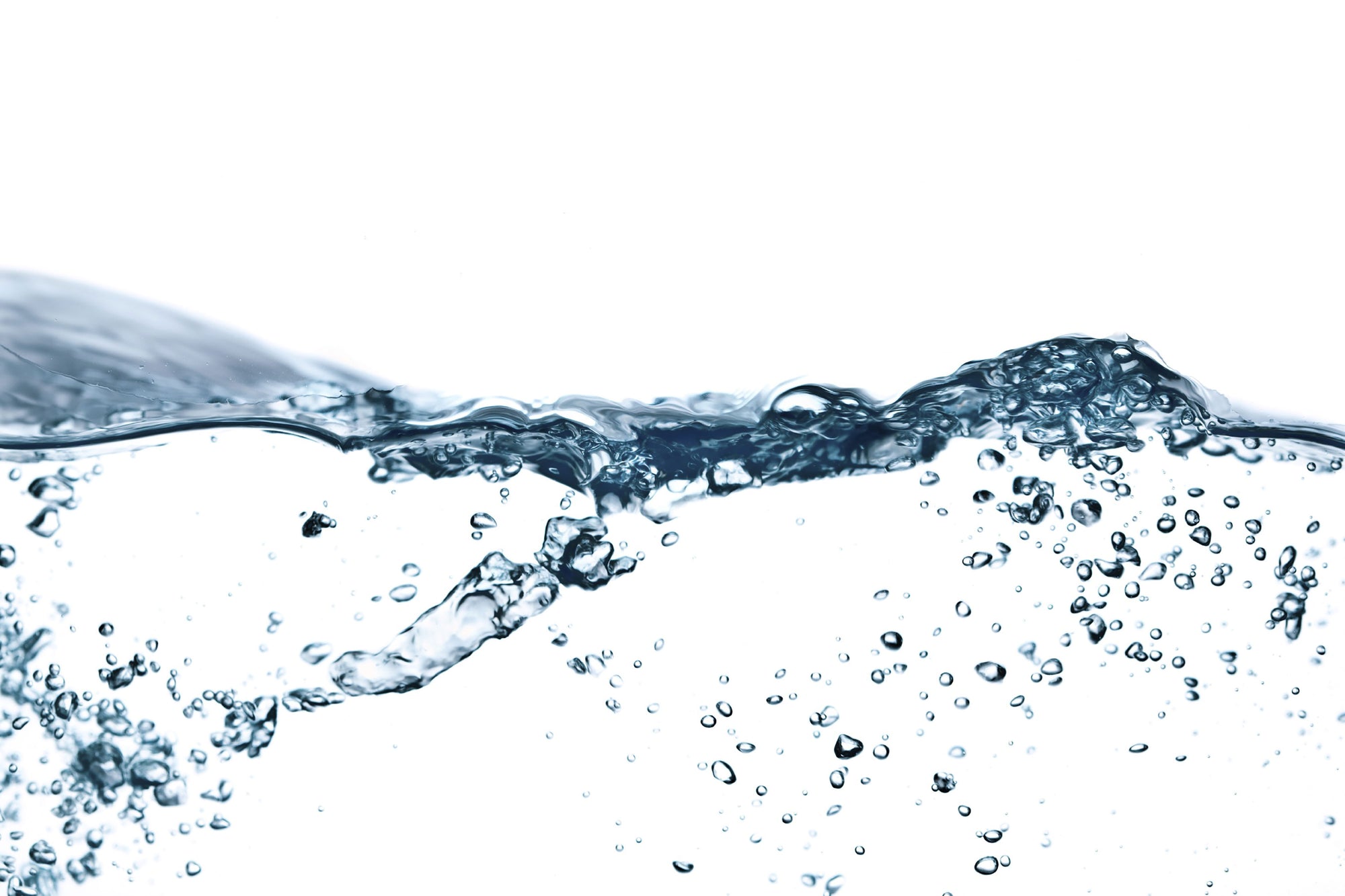 Clear water surface with a wave and suspended bubbles on a white background
