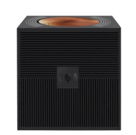 Compact black cube speaker with ribbed sides, copper-finished concave top and front wireless pairing icon.